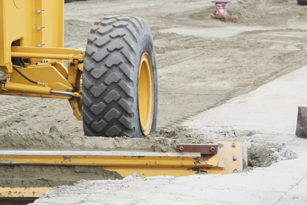 Heavy equipment grading a residential lot in Spring, TX