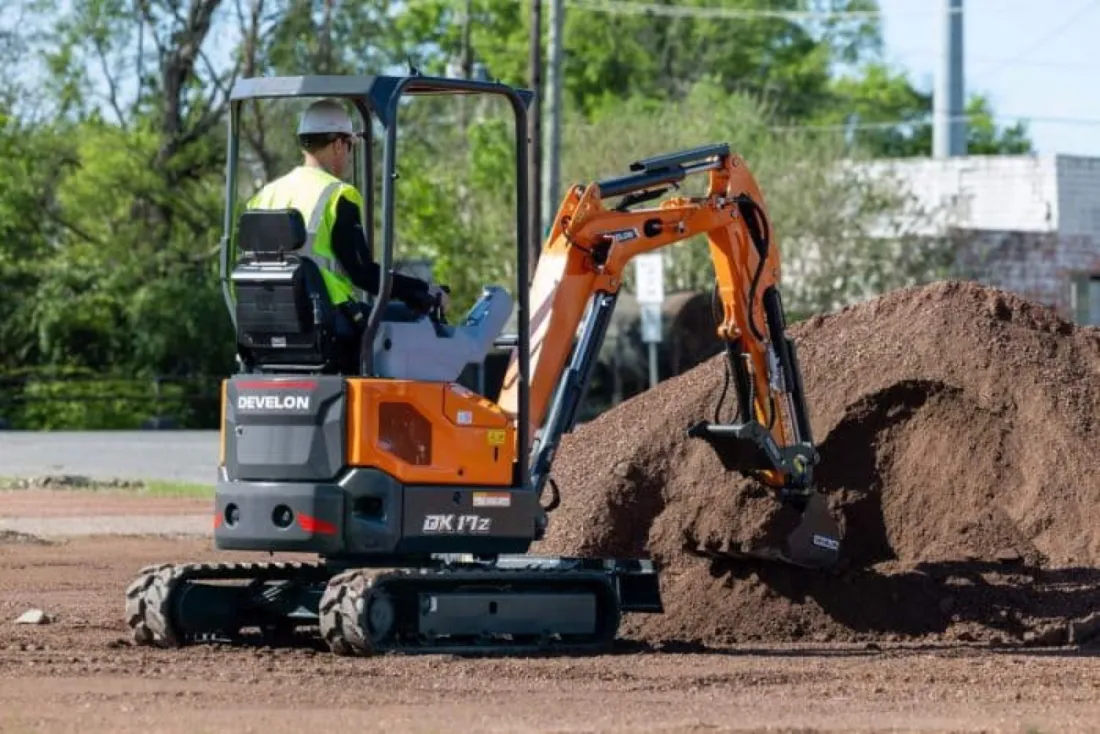 Compact track loader clearing and grubbing a building lot in Spring TX